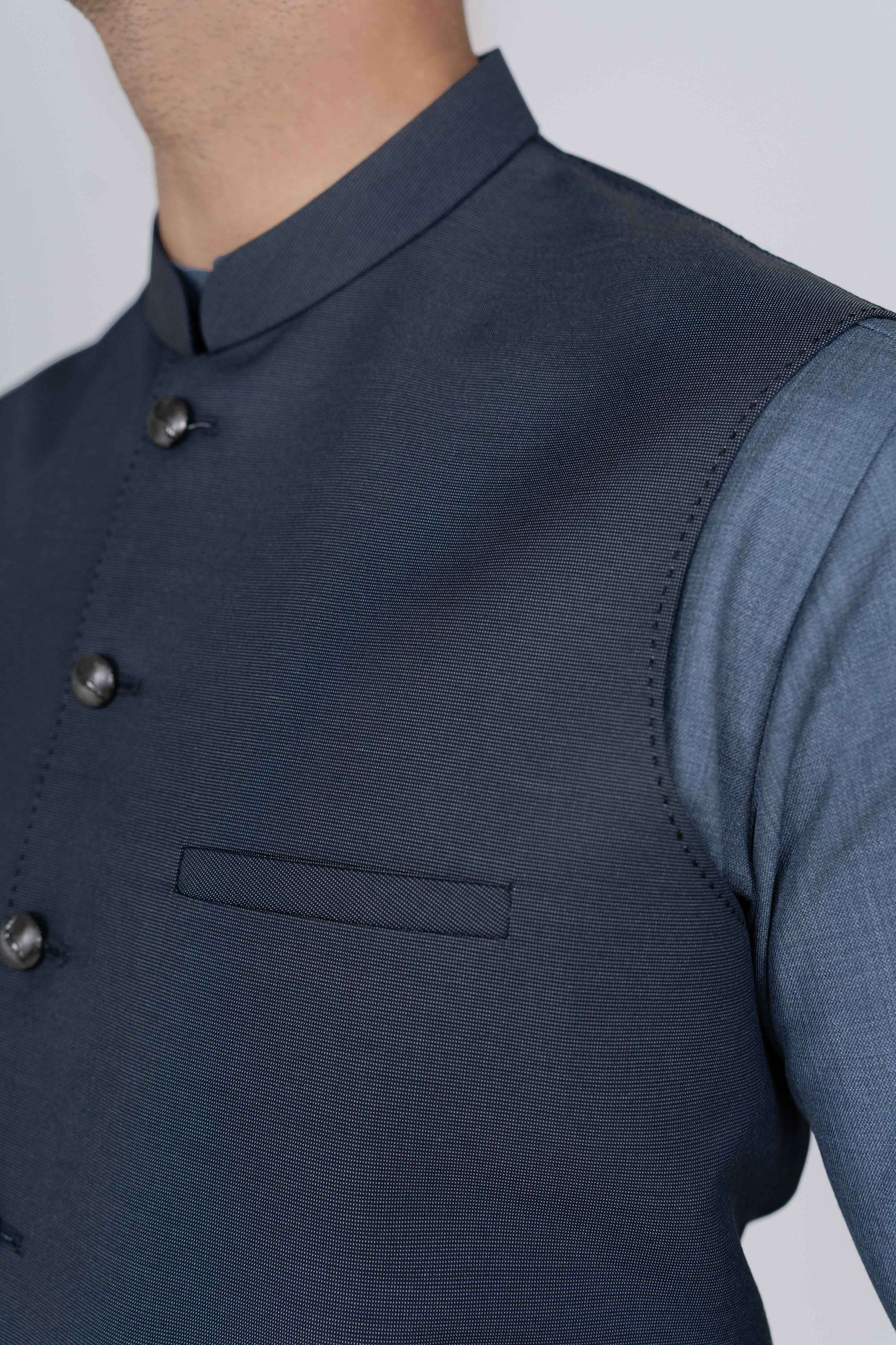 Stitched suiting fabric waist coat in blue, crafted with imported blended fabric and elegant tailored details.
