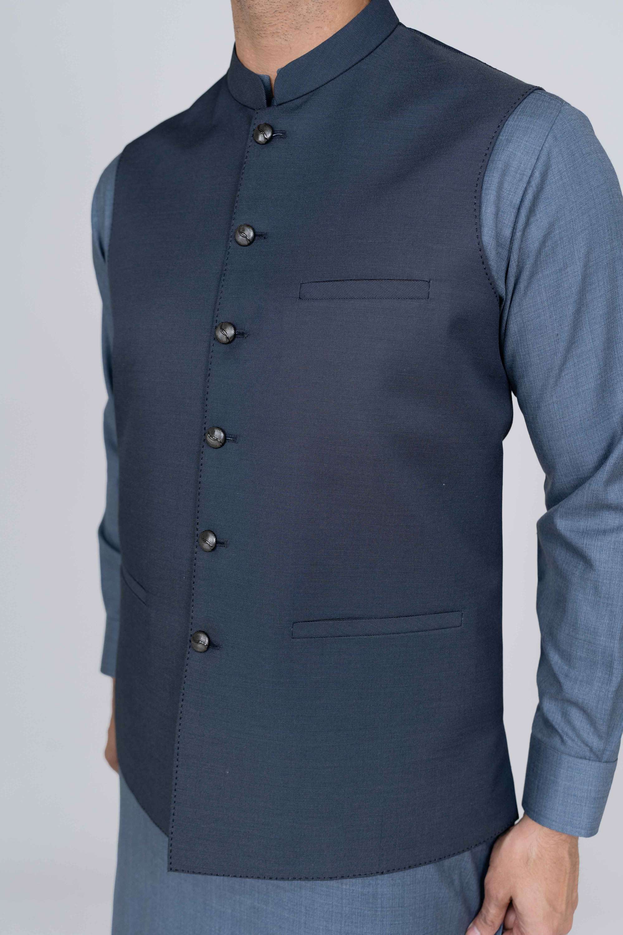 Stitched suiting fabric waist coat in blue, crafted with imported blended fabric and elegant tailored details.