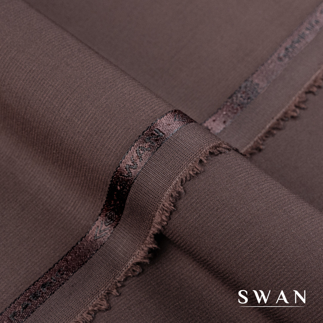 Swan unstitched winter fabric with soft feel and self-textured design, perfect for elegant day and evening wear.
