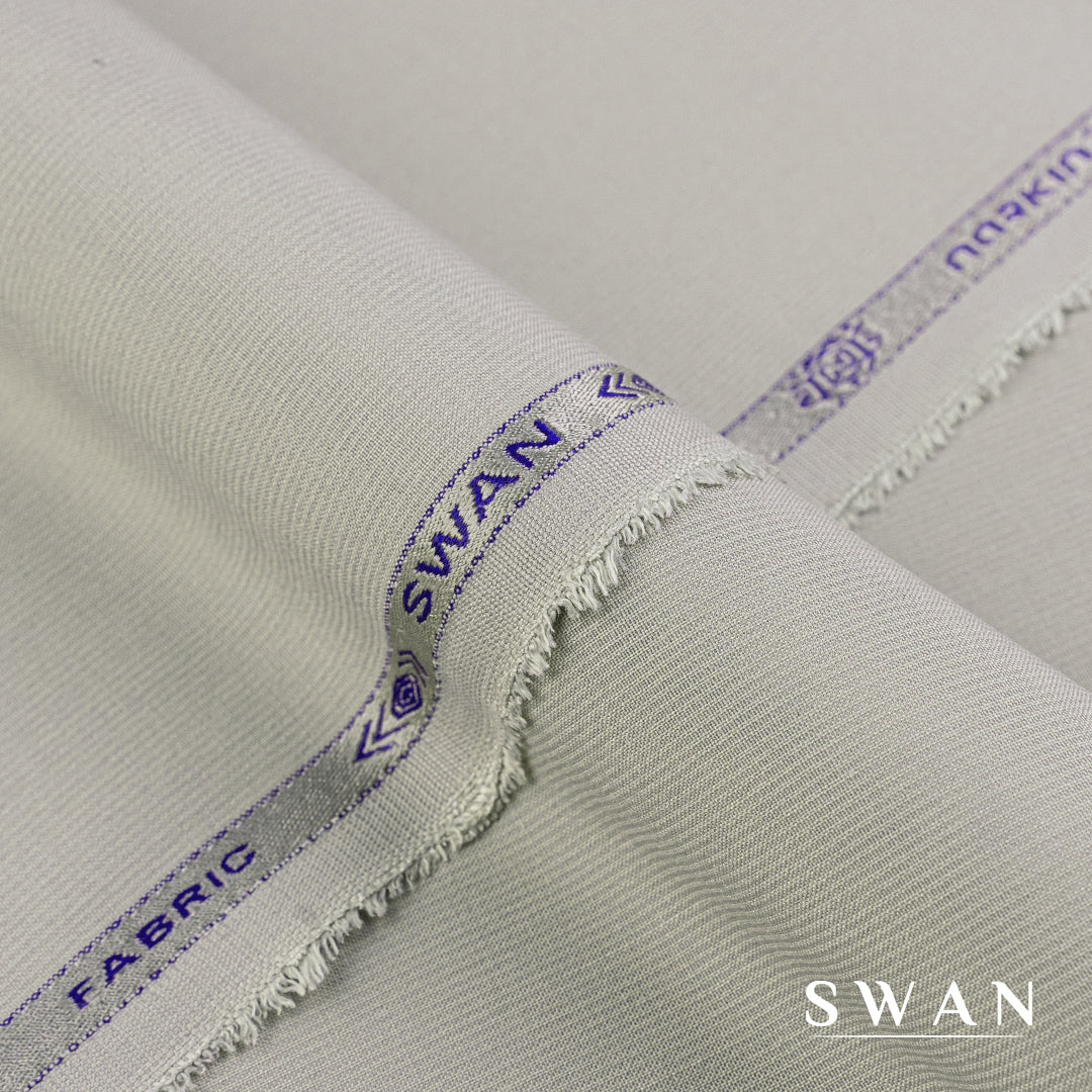 Swan unstitched winter fabric with soft feel and self-textured design, perfect for elegant day and evening wear.