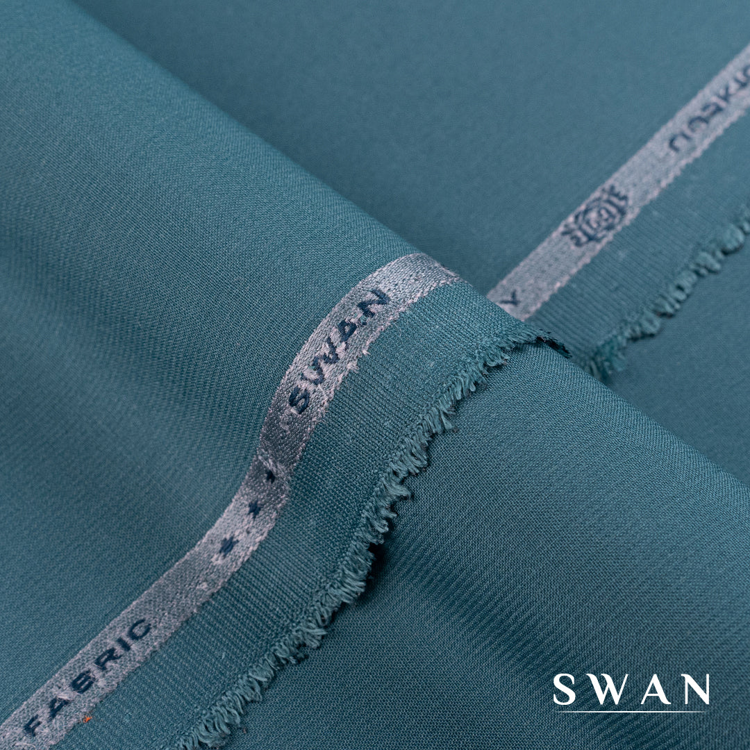 Swan unstitched winter fabric with soft feel and self-textured design, perfect for elegant day and evening wear.