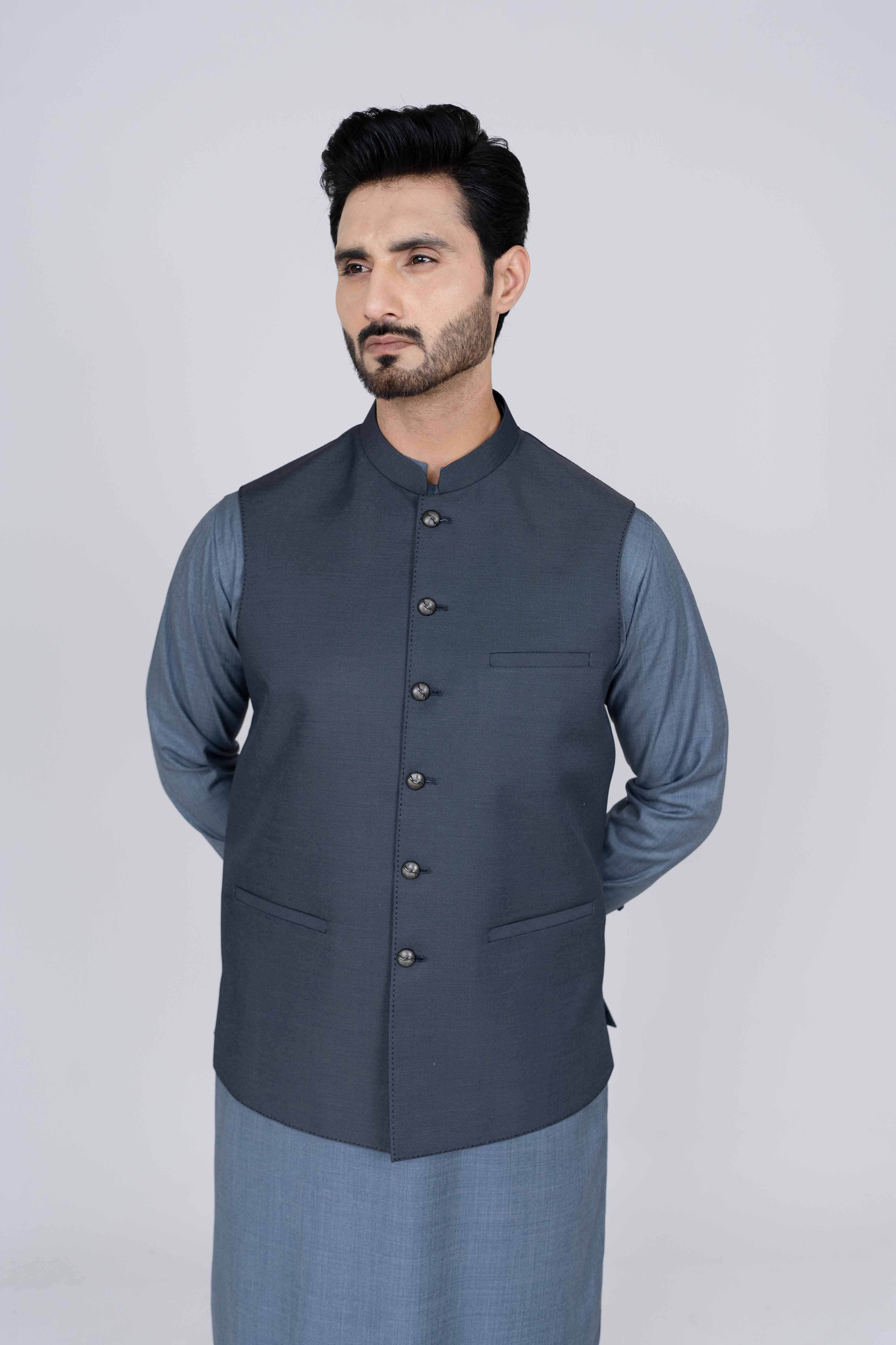 Stitched suiting fabric waist coat in blue, crafted with imported blended fabric and elegant tailored details.