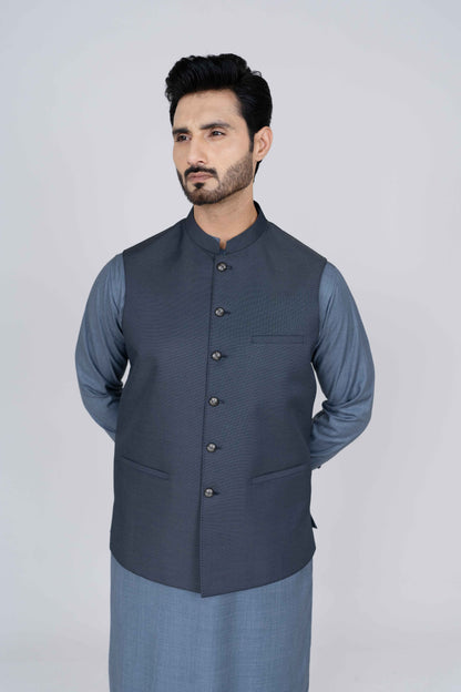 Stitched suiting fabric waist coat in blue, crafted with imported blended fabric and elegant tailored details.