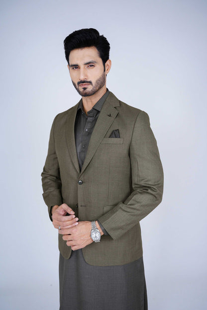 Stitched olive blazer made from premium imported suiting fabric with jetted pockets.