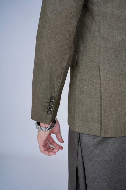 Stitched olive blazer made from premium imported suiting fabric with jetted pockets.