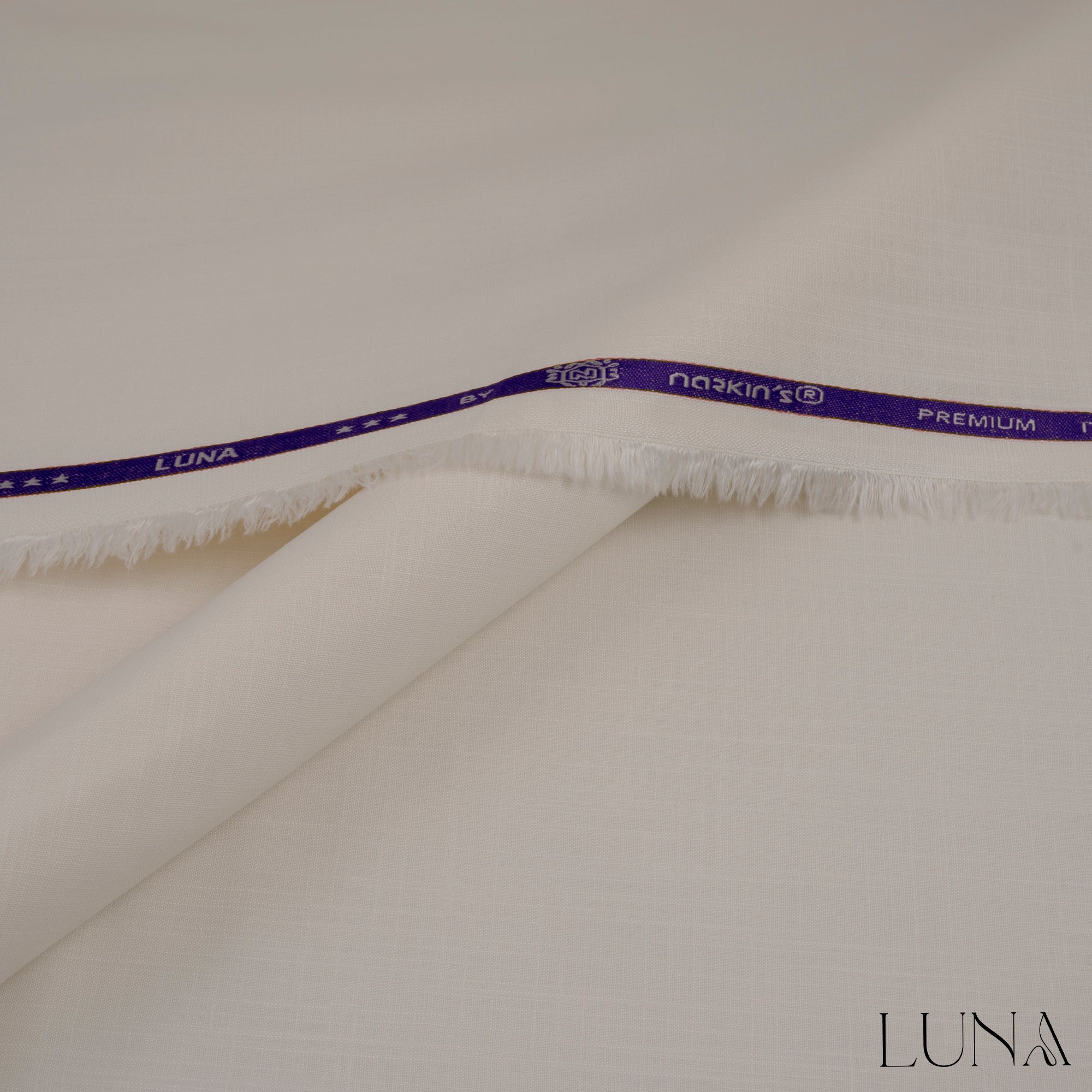 una unstitched winter wash & wear fabric with textured slubby finish in elegant winter colors