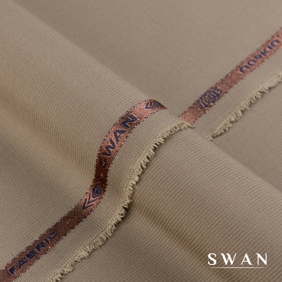 Swan unstitched winter fabric with soft feel and self-textured design, perfect for elegant day and evening wear.