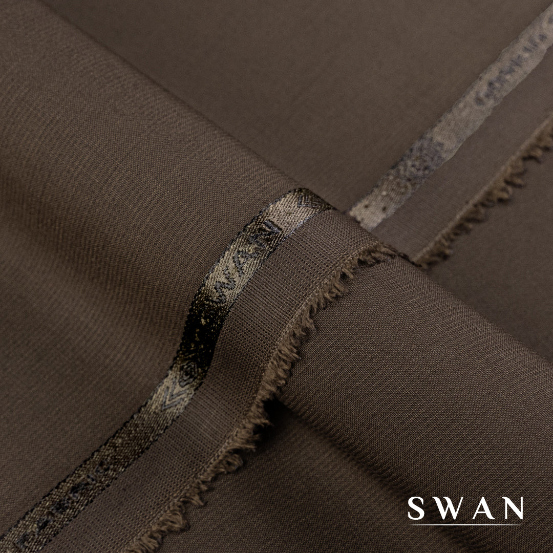 Swan unstitched winter fabric with soft feel and self-textured design, perfect for elegant day and evening wear.